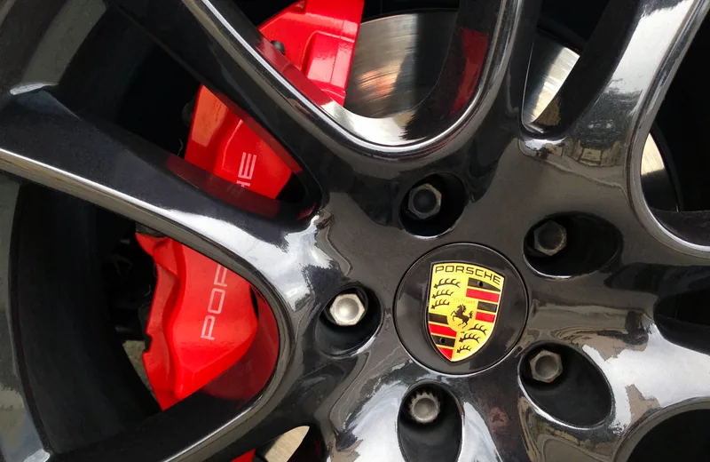 Detailed Porsche wheel face with visible spokes and brake caliper