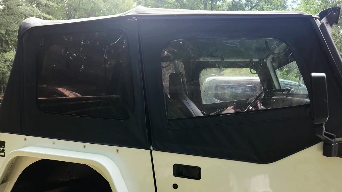 Finished black Jeep soft top after cleaning and revitalization