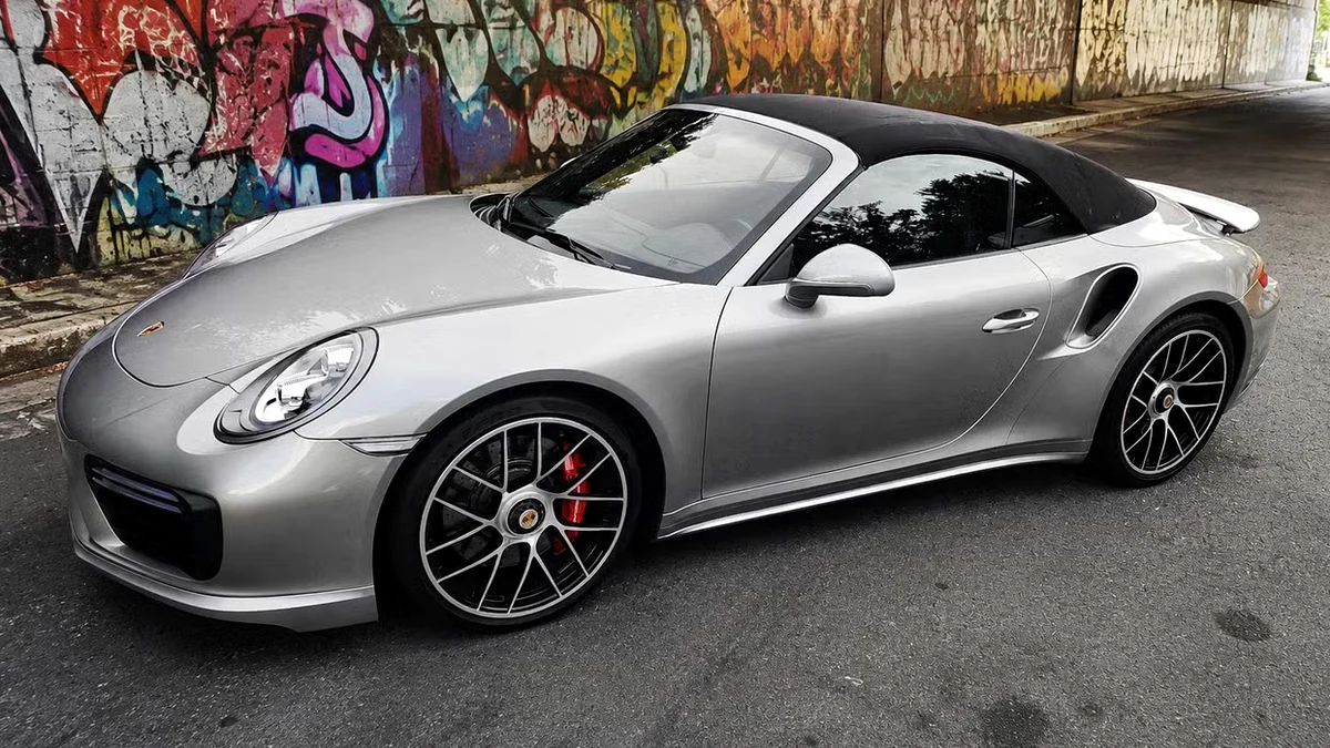 Black fabric roof on the detailed silver Porsche 911 Turbo Cabriolet